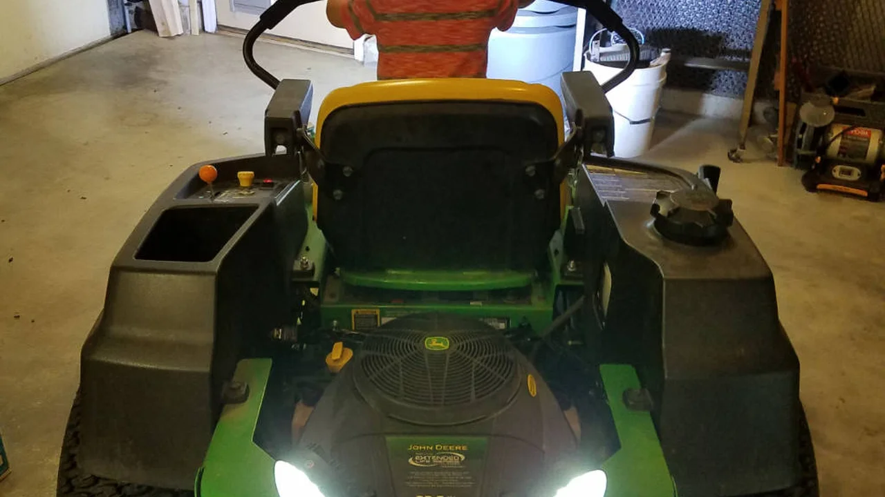 Two mint chocolate milkshakes with whipped cream and green sprinkles.